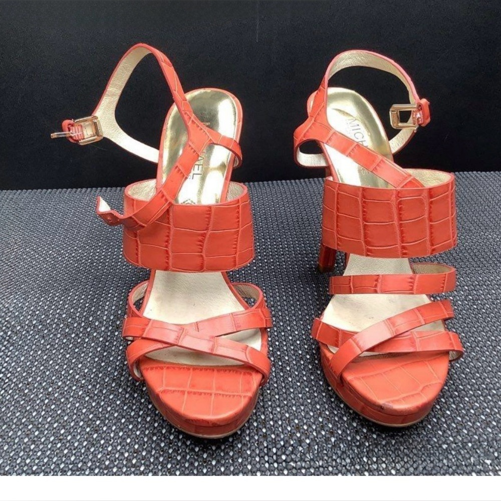Michael Kors Nadja platform sandals in mandarin embossed leather.